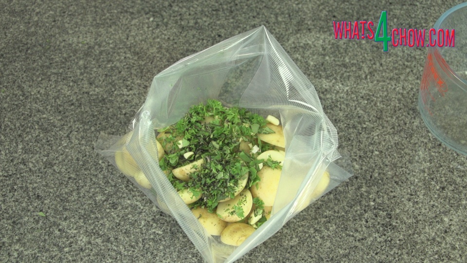 Place Potatoes, Herbs, Garlic, Butter &amp; Oil in Vacuum Bag.jpg