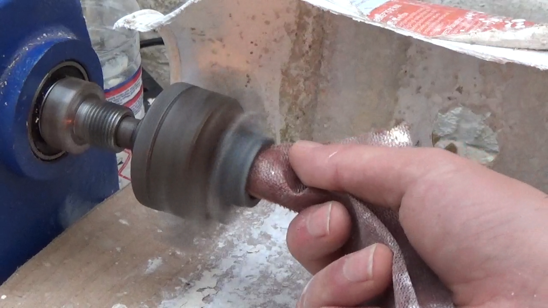 Polishing inside of corian ring on lathe.bmp