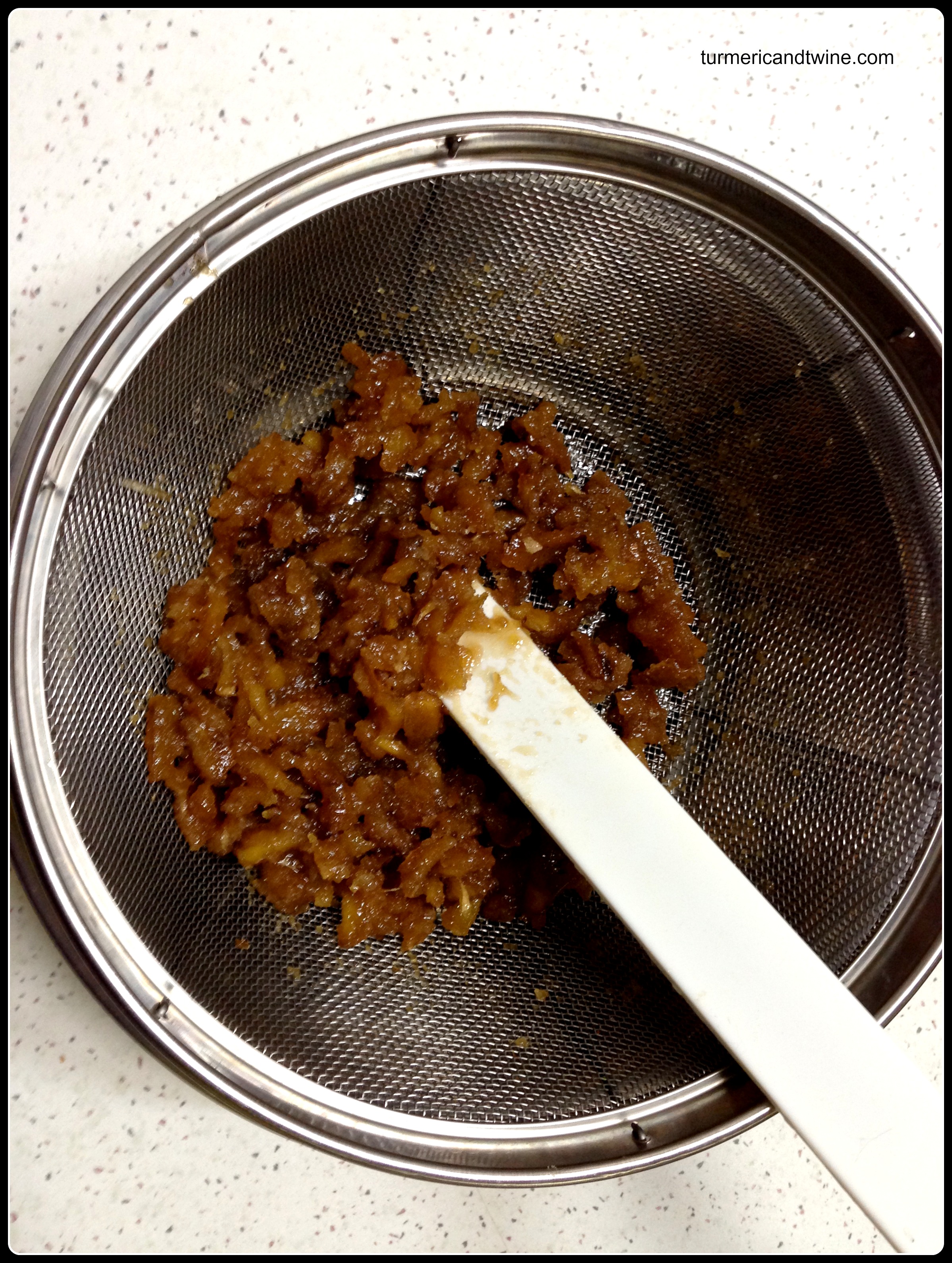 Separating ginger syrup from candied ginger .jpg.jpg