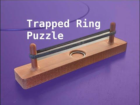 Solving the Trapped Ring Puzzle