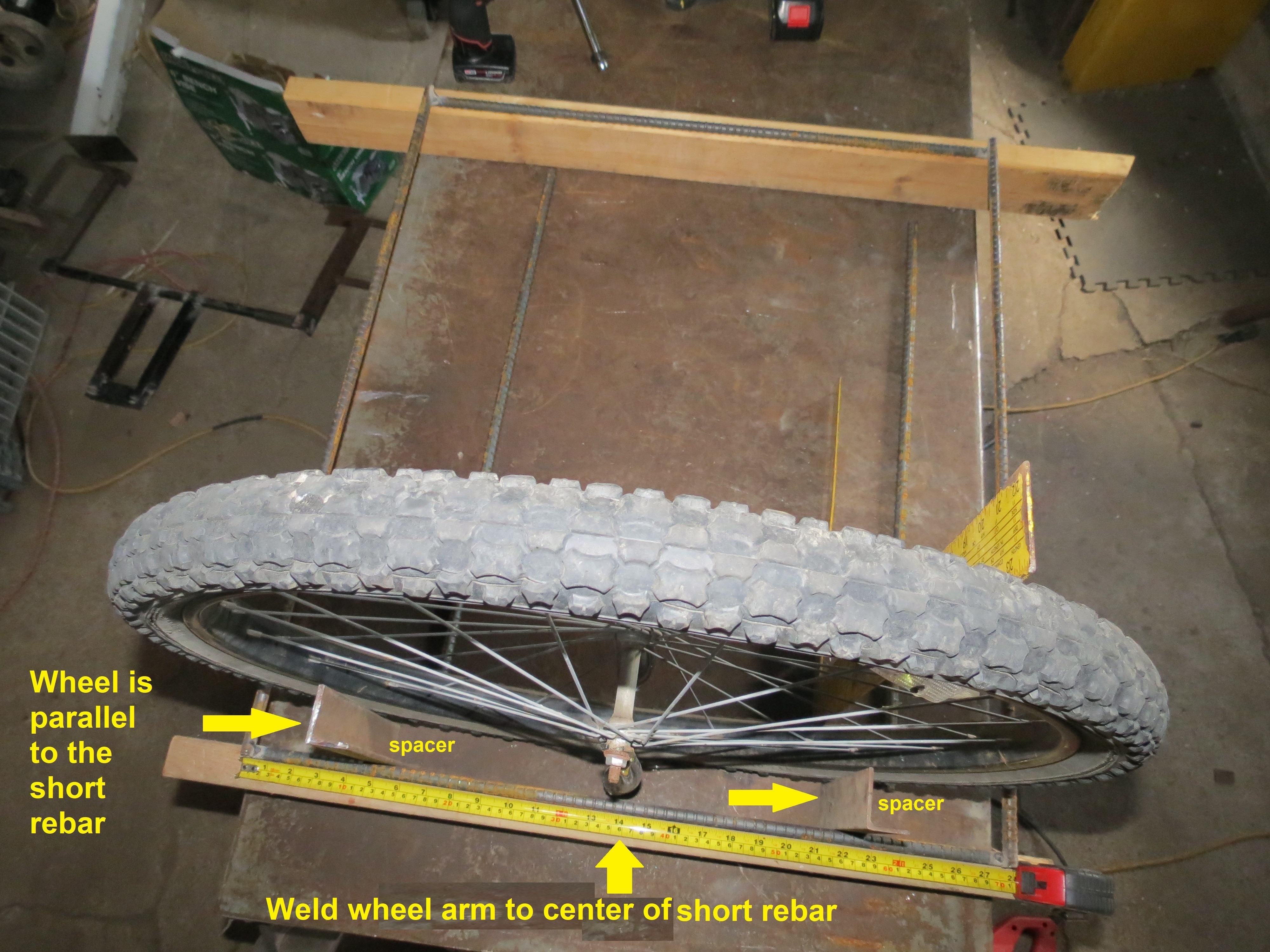 Step 05 Position wheel parallel and vertical and weld to center of 28in bar.JPG