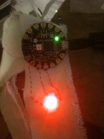 Tested one neopixel to flora with conductive thread on.jpg