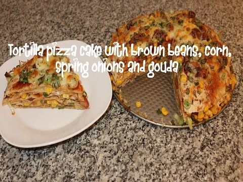 Tortilla pizza cake with brown beans, corn, spring onions and gouda