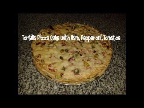 Tortilla pizza cake with ham, pepperoni, tomatoe