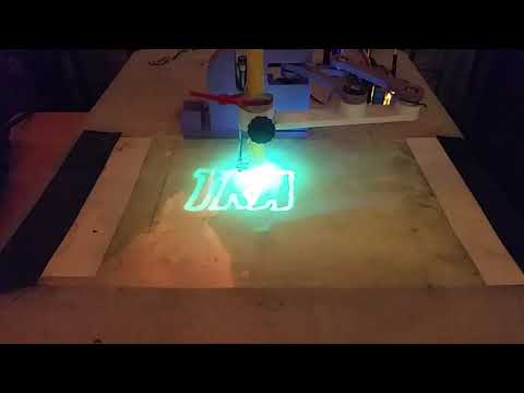 Tracey - drawing on glow in the dark paint using a UV LED