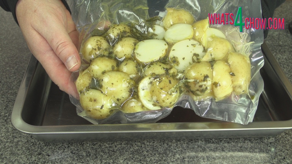 Transfer Boiled Infused Potatoes to Roasting Tin.jpg