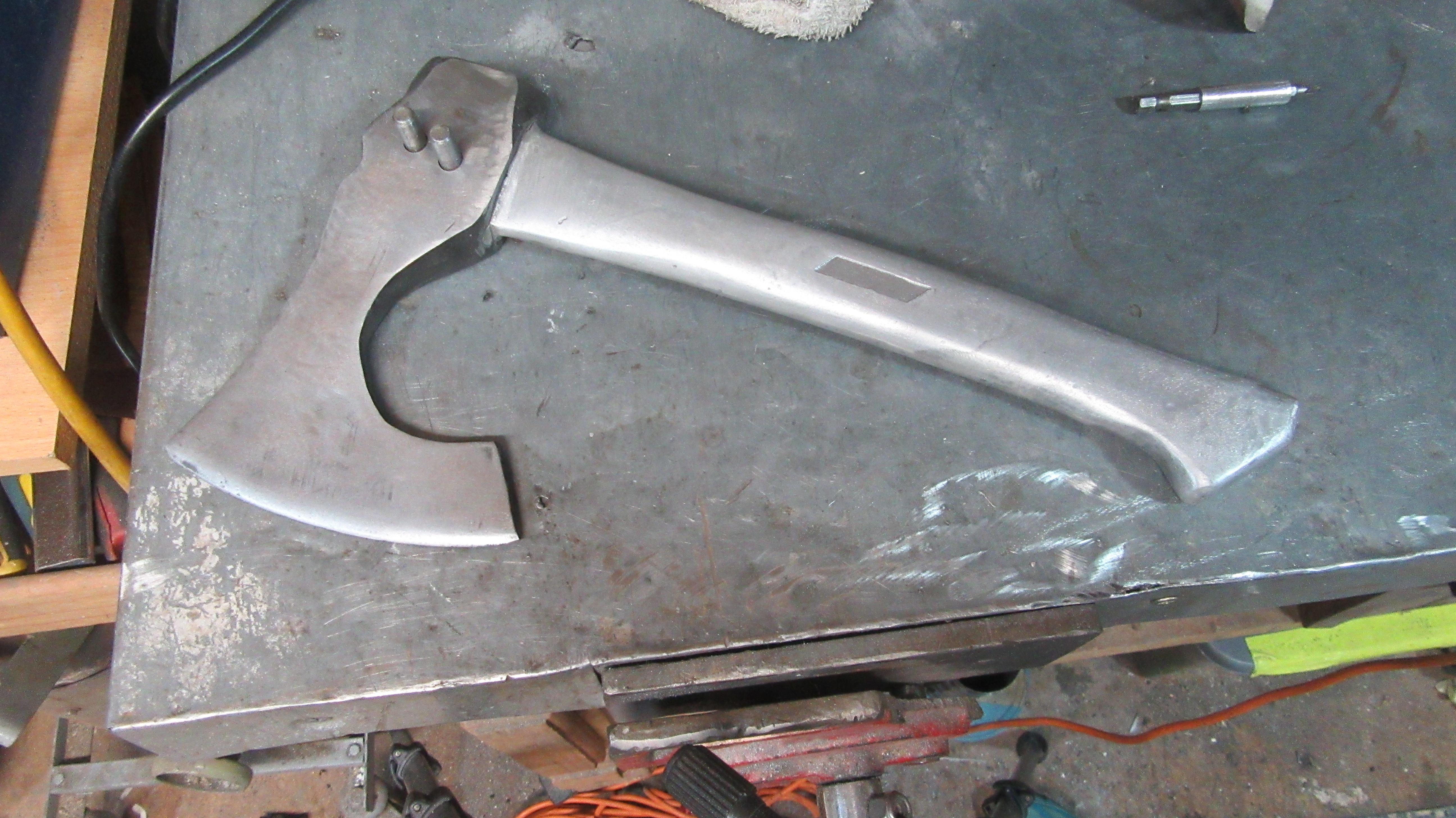 Viking axe welding with aluminum sand casting of the handle.JPG