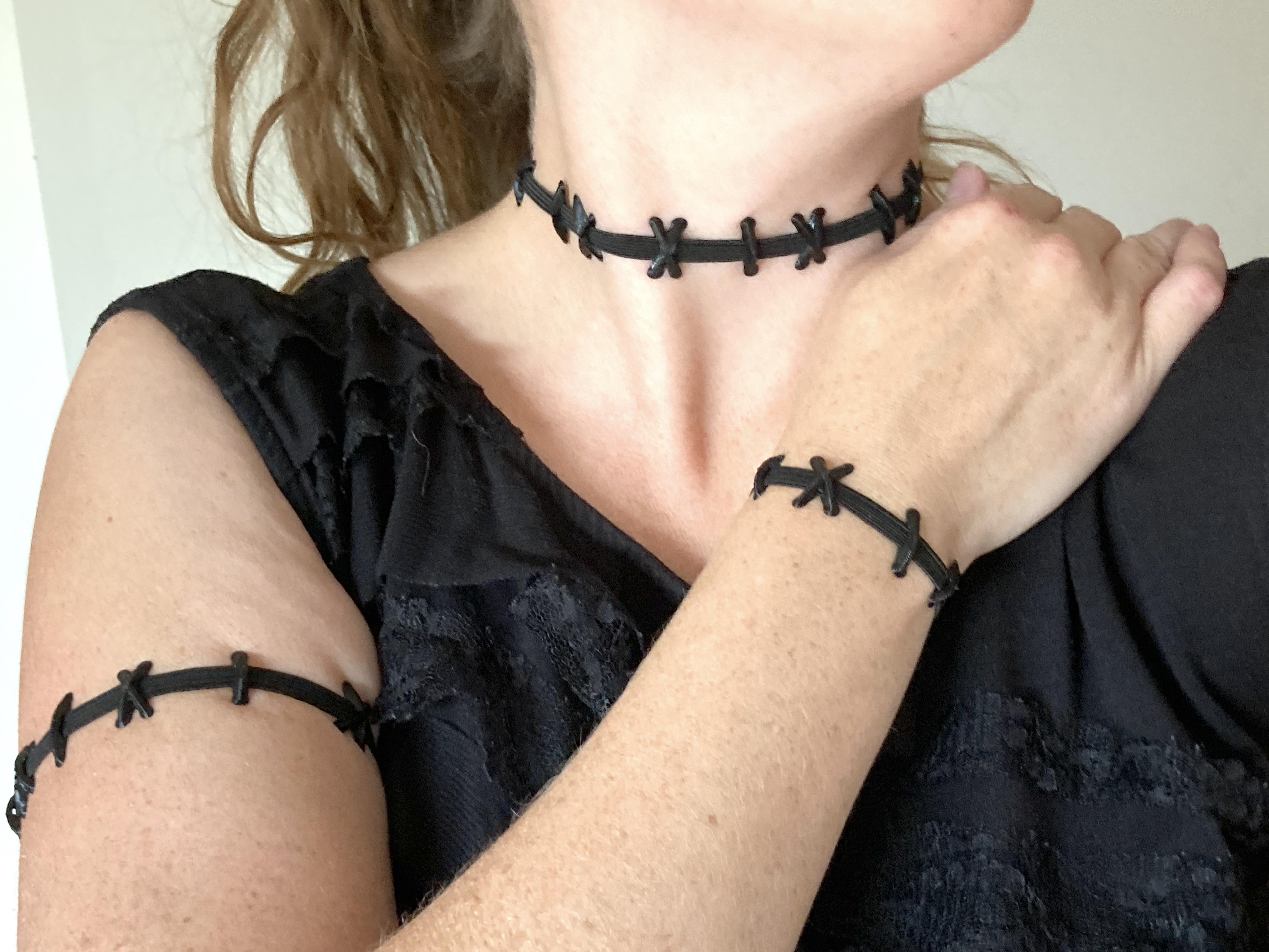 Wearing elastic stitched neck choker, bracelet, and armband.JPG