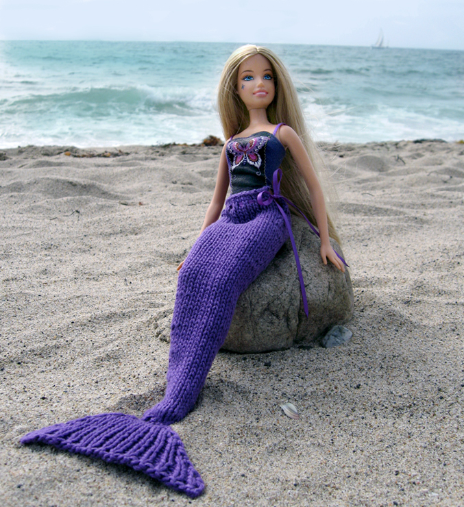 a mermaid at the beach