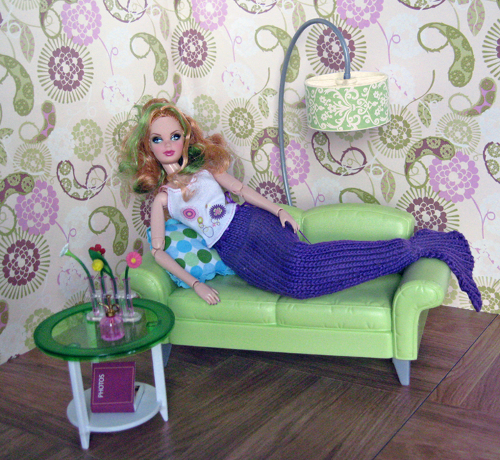 a mermaid on the couch