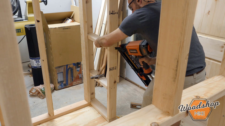 adding roosting rail to shed _ How to make a DIY chicken coop.jpg