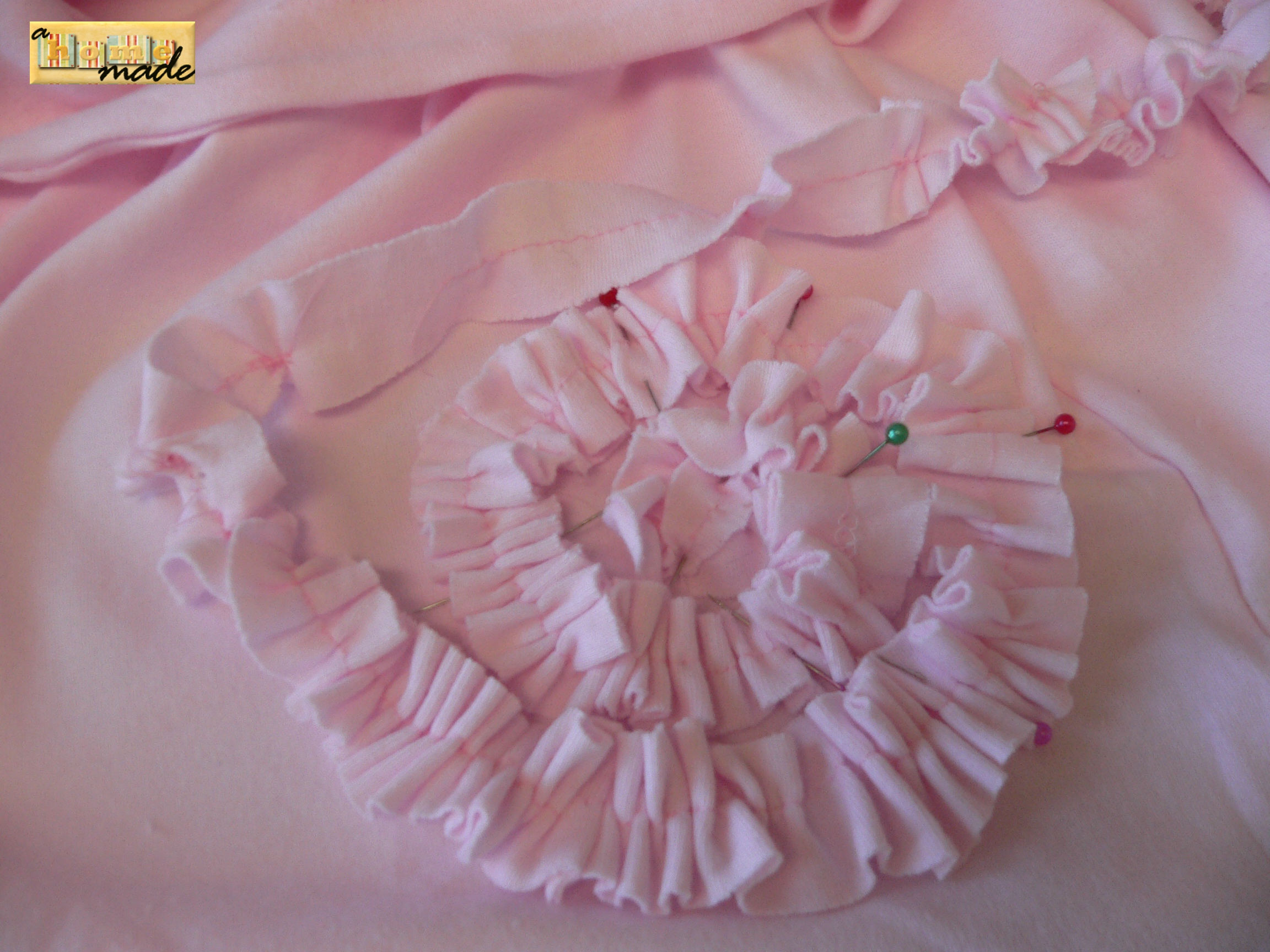 begin pinning ruffle to the skirt in cpiral pattern.JPG