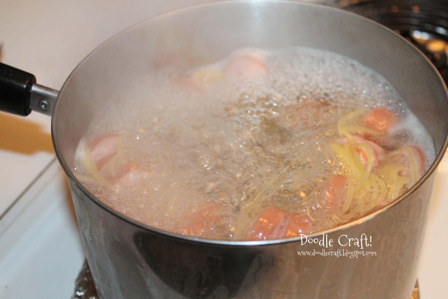 boiling noodles in pan on stove top.jpg