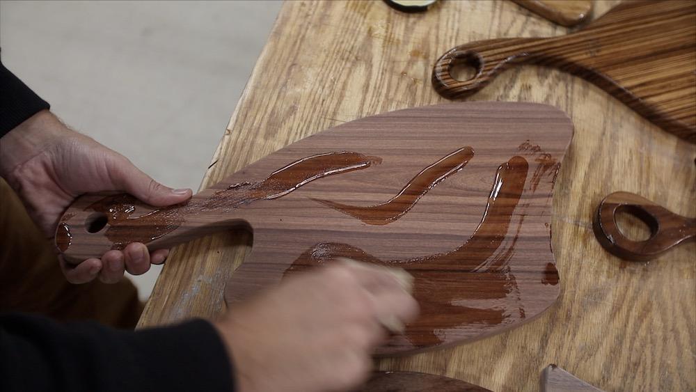 bubinga-charcuterie-board-applying-finish.jpeg