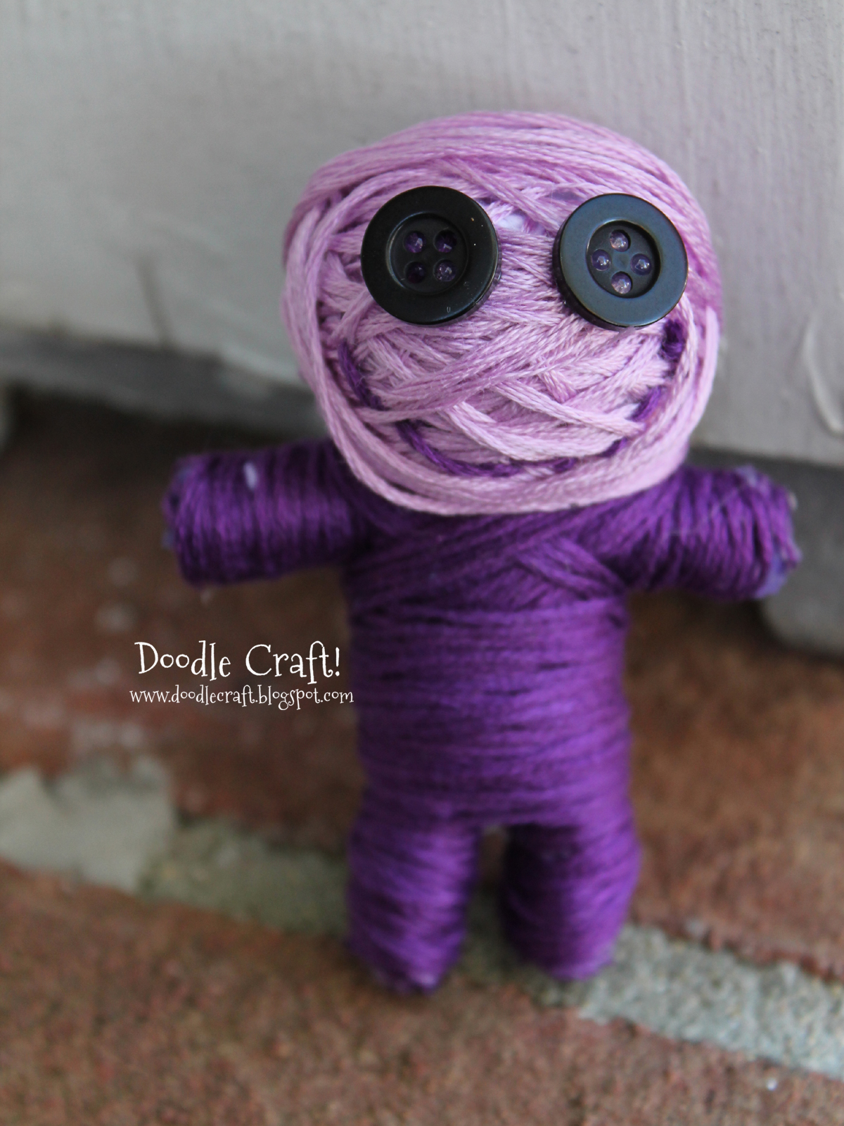 button eye purple string doll.jpg