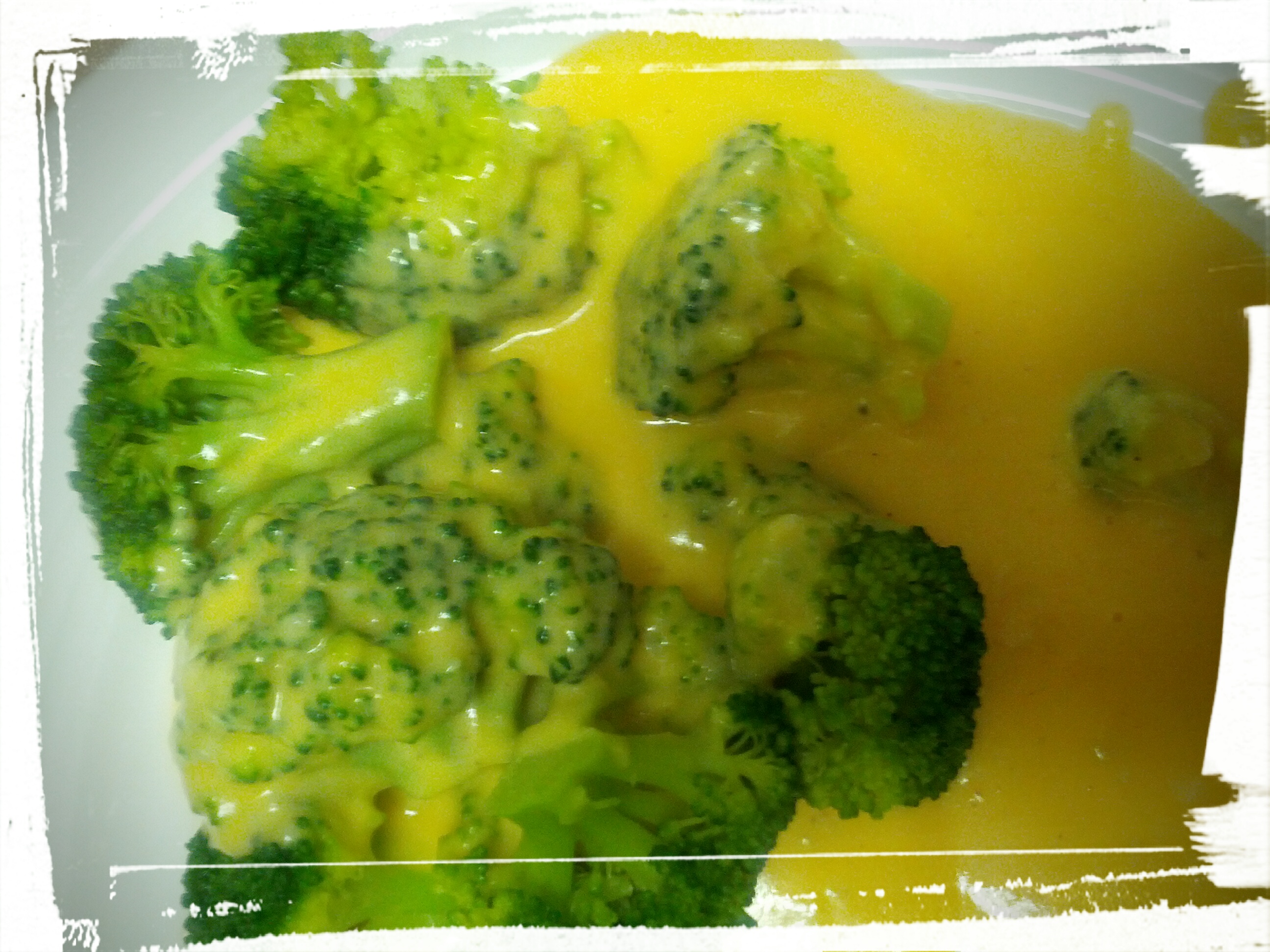 cheese sauce served over broccoli.jpg