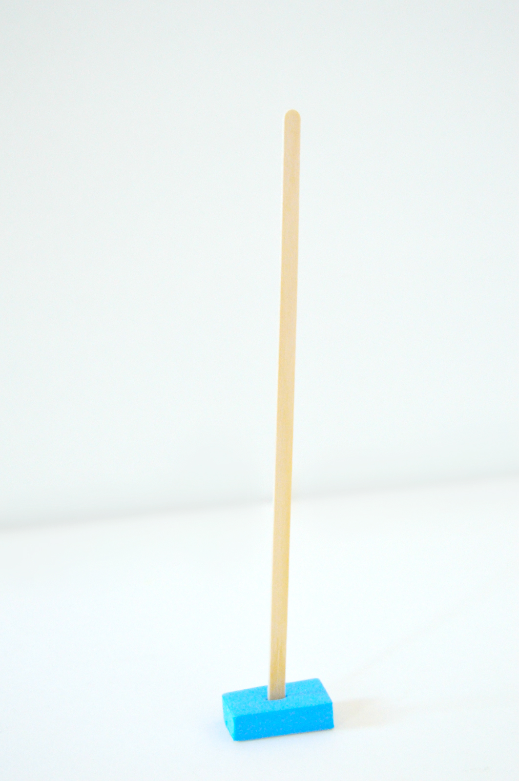 coffee stirrer to a piece of foam.jpg