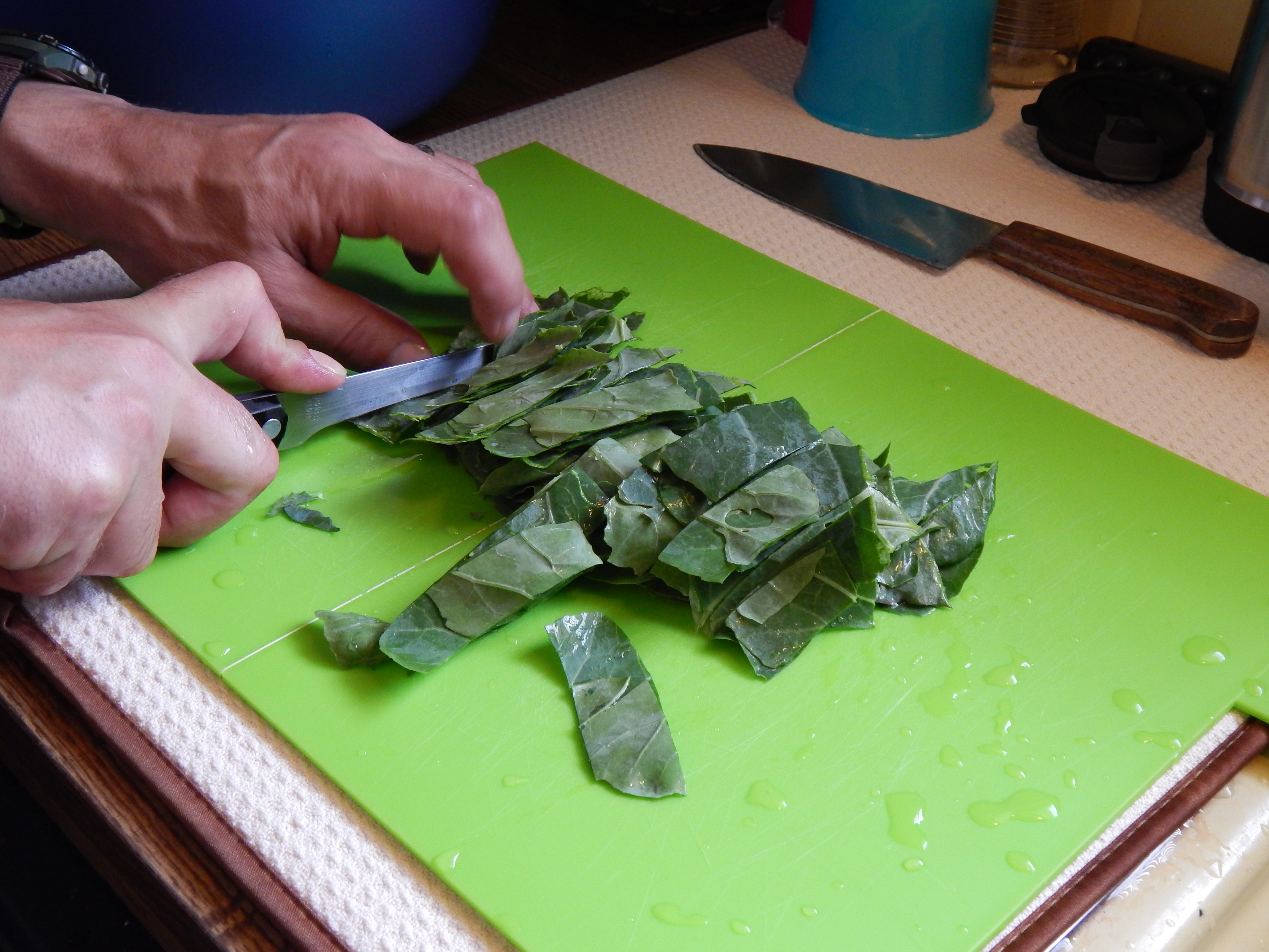 cutting collard greens in strips.jpg