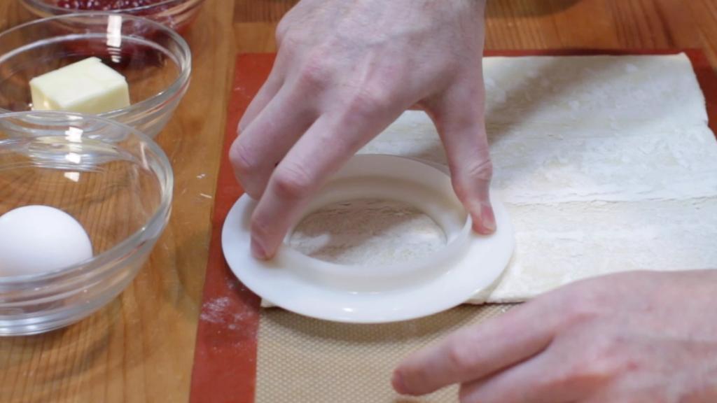 cutting rounds out of puff pastry.jpg