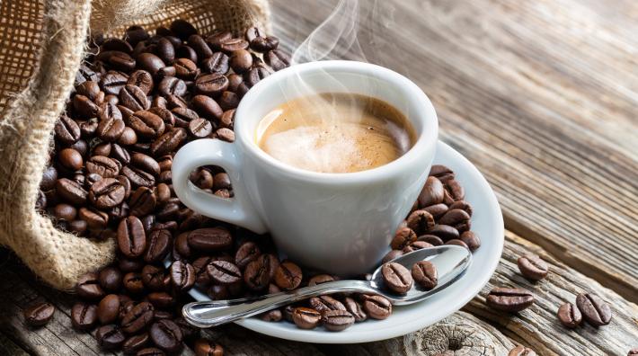 espresso-coffee-cup-with-beans-on-table-restricted.jpg