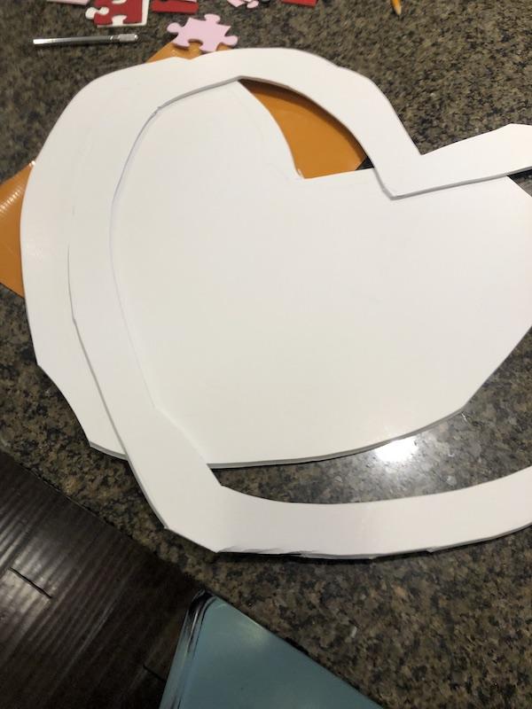 exacto knife cutting heart shape from the foam board.JPG