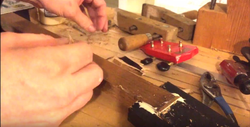 fill gap on front of headstock joint with sawdust, glue, and wood scraps.jpg