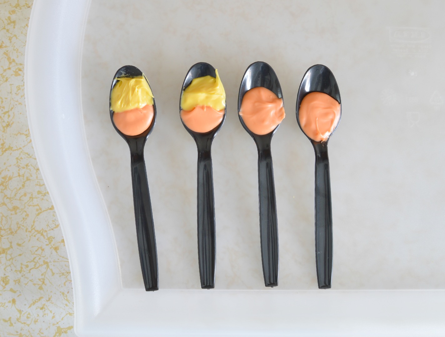 fill the second color melted chocolate for candy corn spoons.jpg