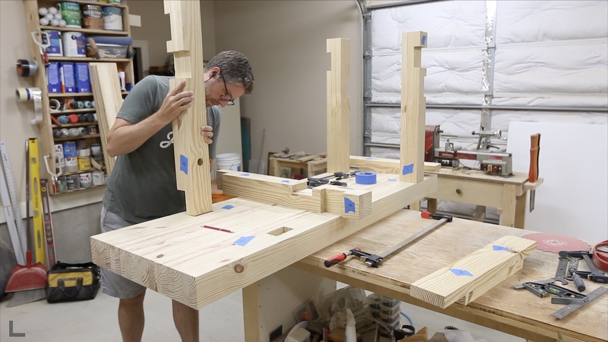 fitting legs into workbench top.jpeg