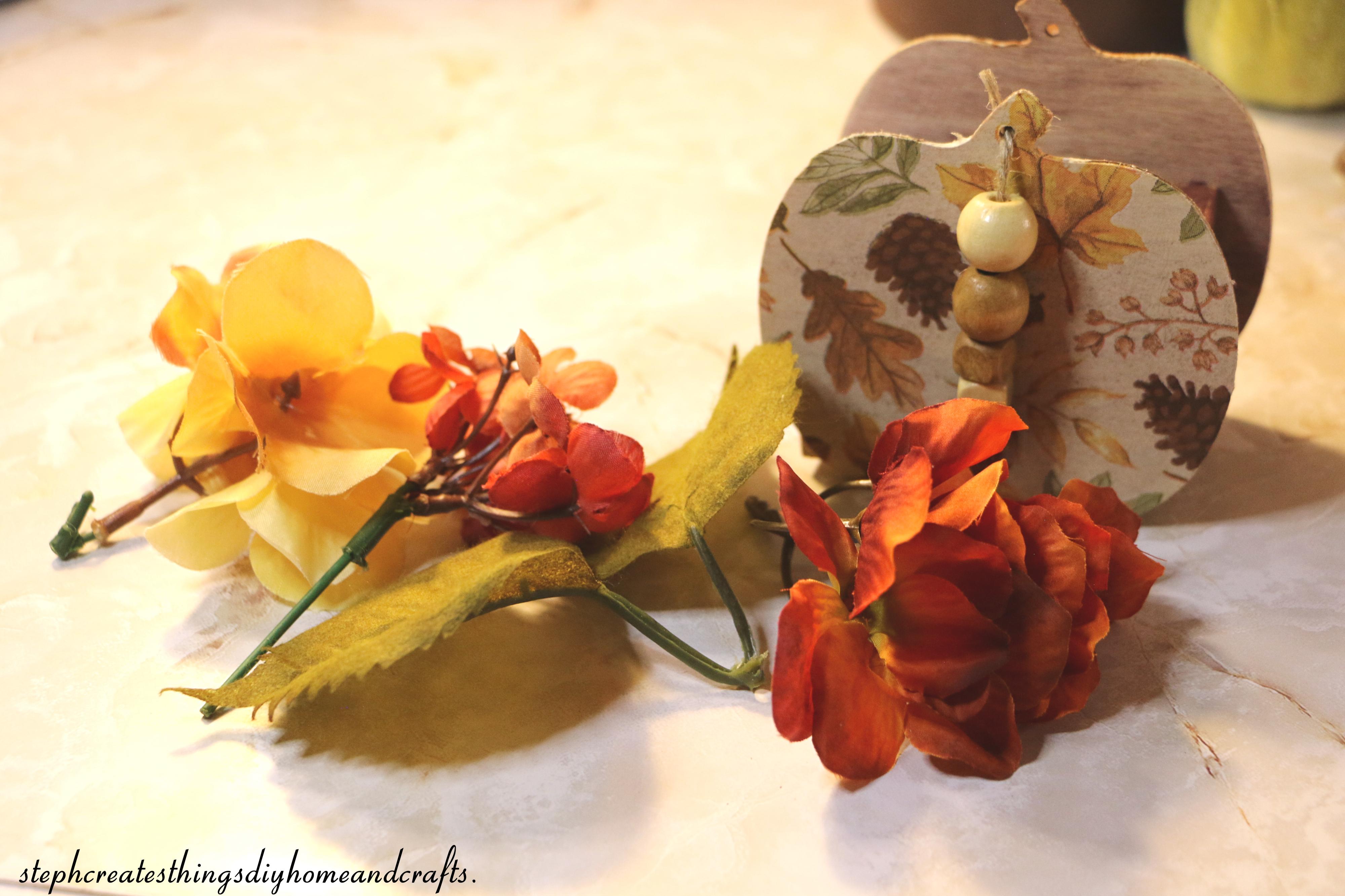 floral with wooden pumpkin display.jpg