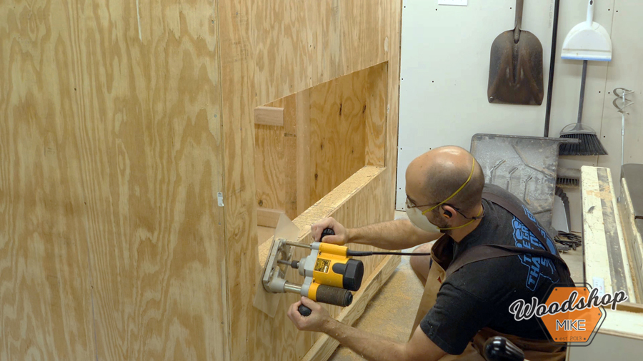 flush cut sheathing with router _ How to make a DIY chicken coop.jpg