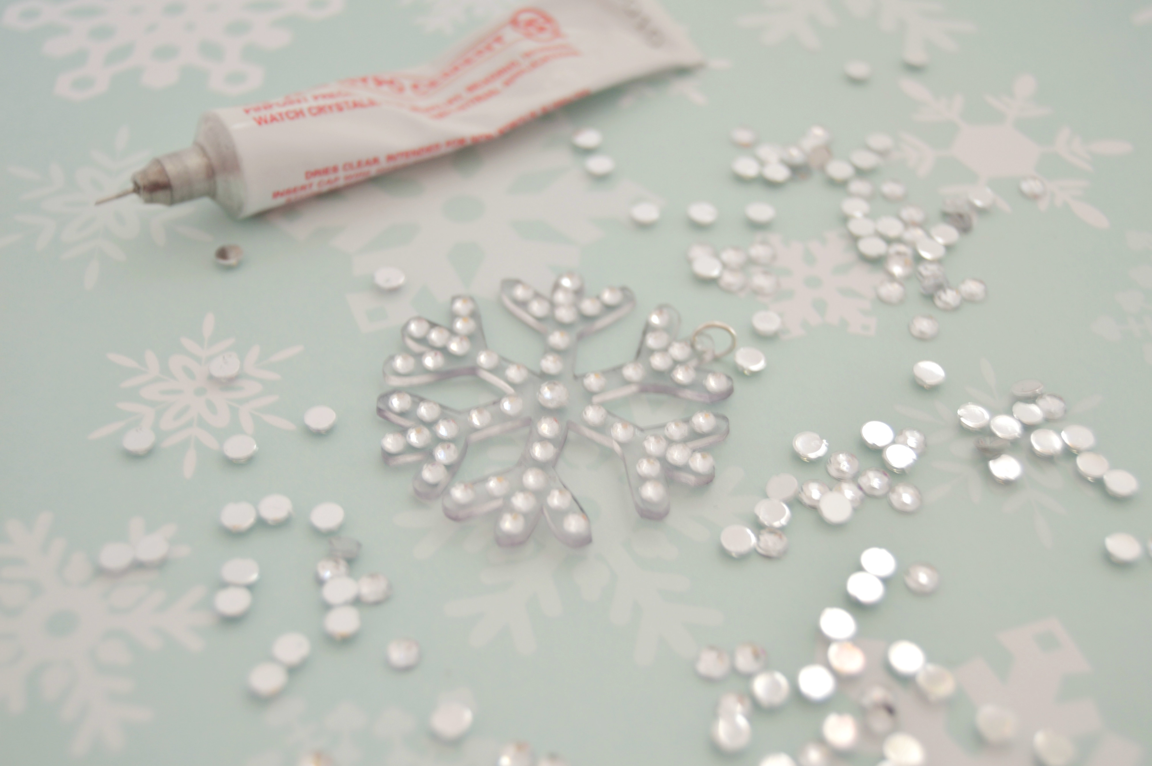 gluing rhinestones to snowflake.jpg