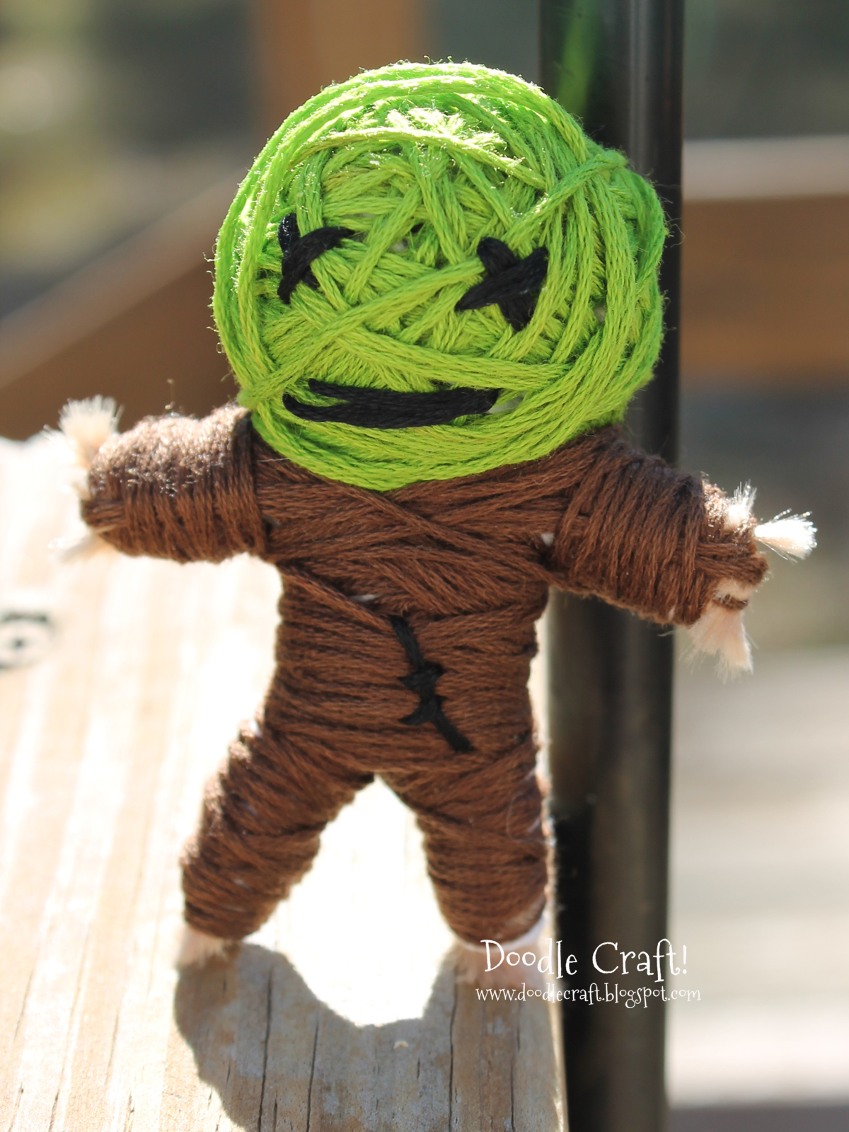 green faced zombie scarecrow string voodoo doll.jpg