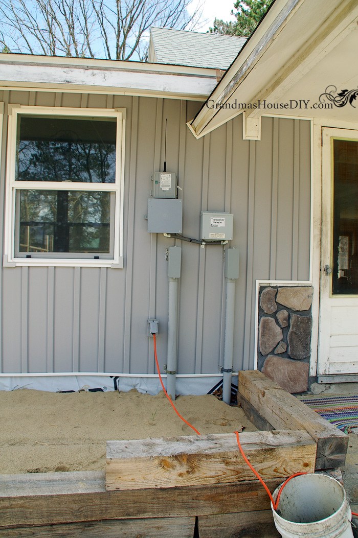 hiding-electrical-panel-outside-house-fence.jpg