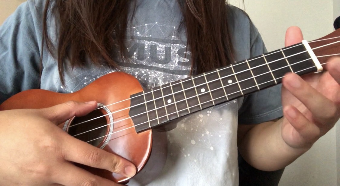 holding a ukulele full shot.jpeg