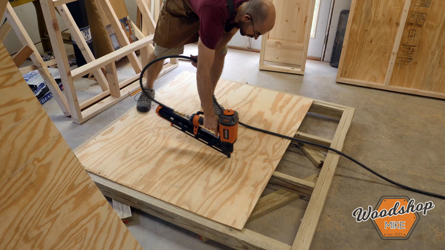 installing chicken coop sub floor _ How to make a DIY chicken coop.jpg