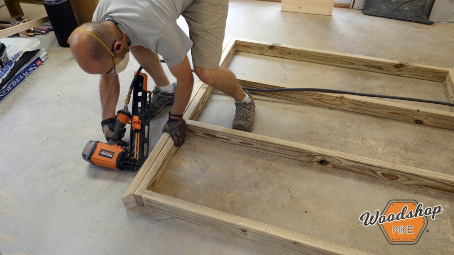 installing trim boards _ How to make a DIY chicken coop.jpg