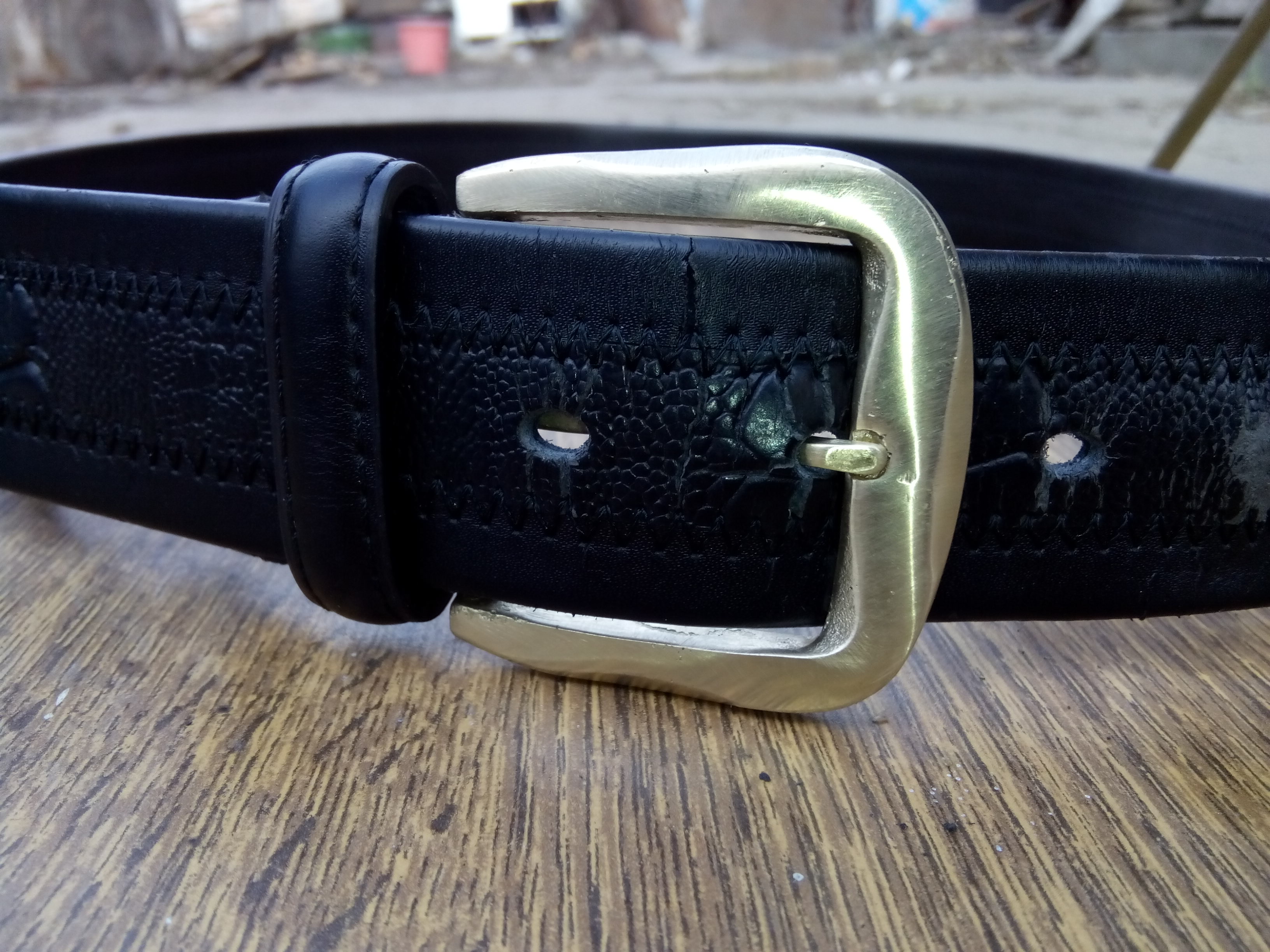 leather belt with a buckle.jpg