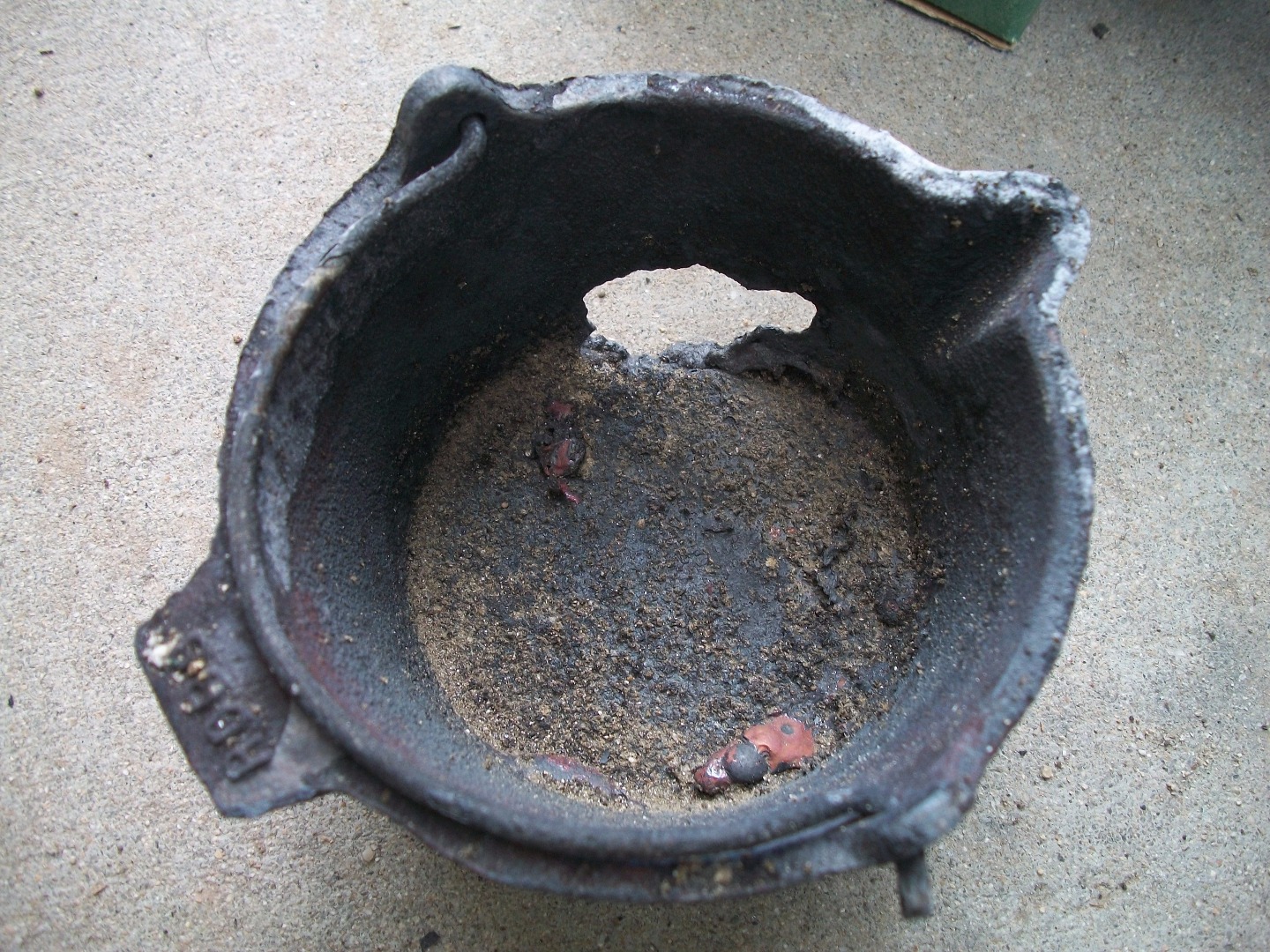 melted thru cast iron pot III.JPG