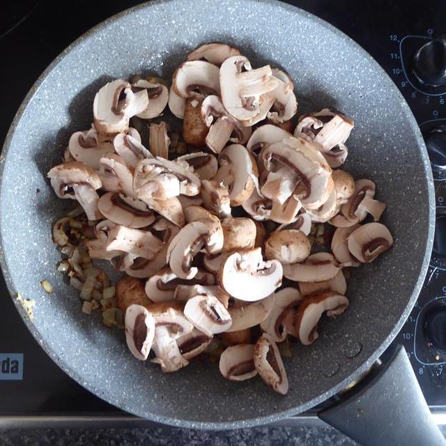 onions and mushrooms in blue frying pan raw.JPG