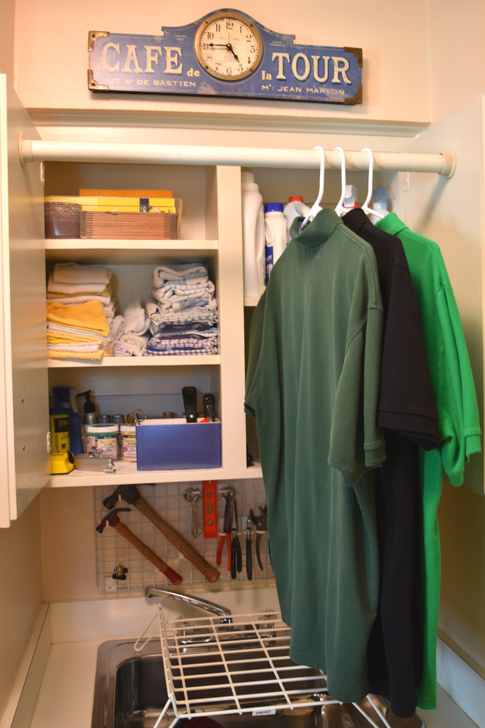 open upper cabinet w clothes.jpg