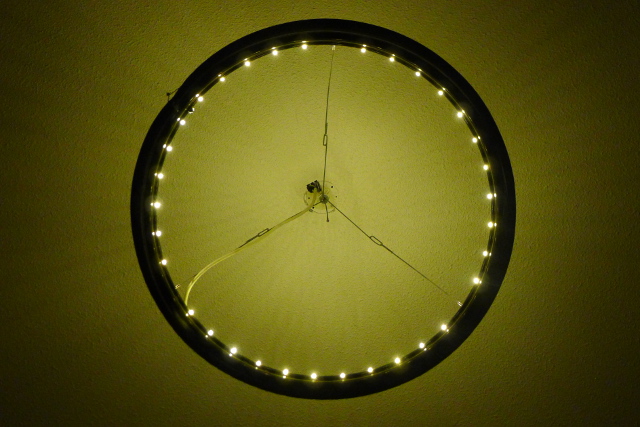 openproducts_chandelier_evening_view_with_spoke_shadow_on_ceiling.jpg