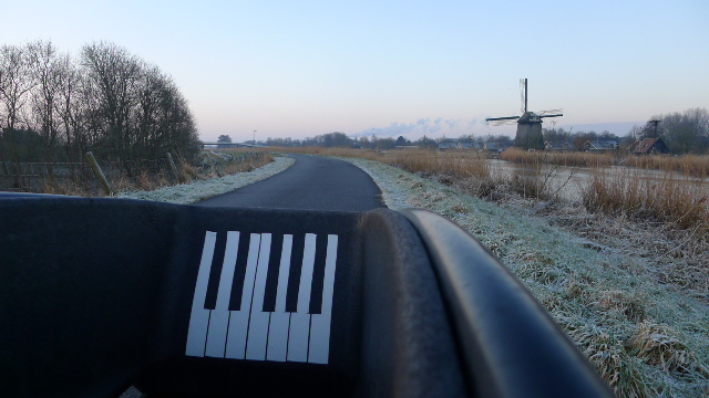 openproducts_piano-keys_CC_BY_keyboard_view_with_windmill_and_road.jpg