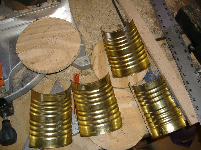 plywood rounds w half cut cans.JPG