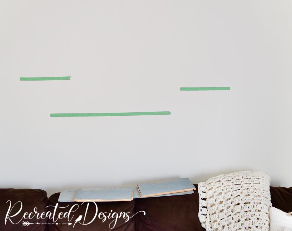 pre-planning-shelf-location-livingroom-wall-tape-Recreated-Designs.jpg