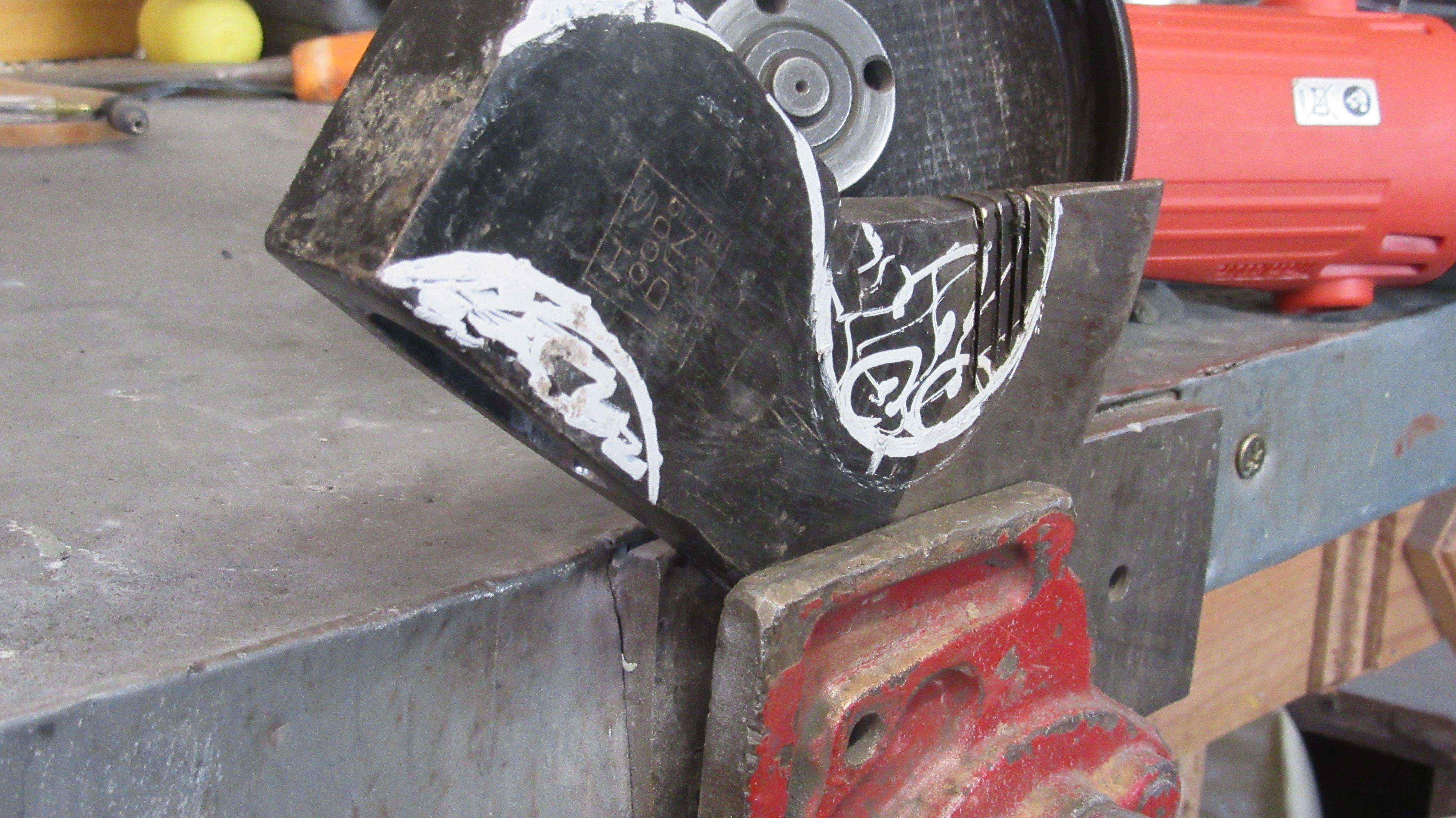 shaping the Viking axe head with a grinder.JPG