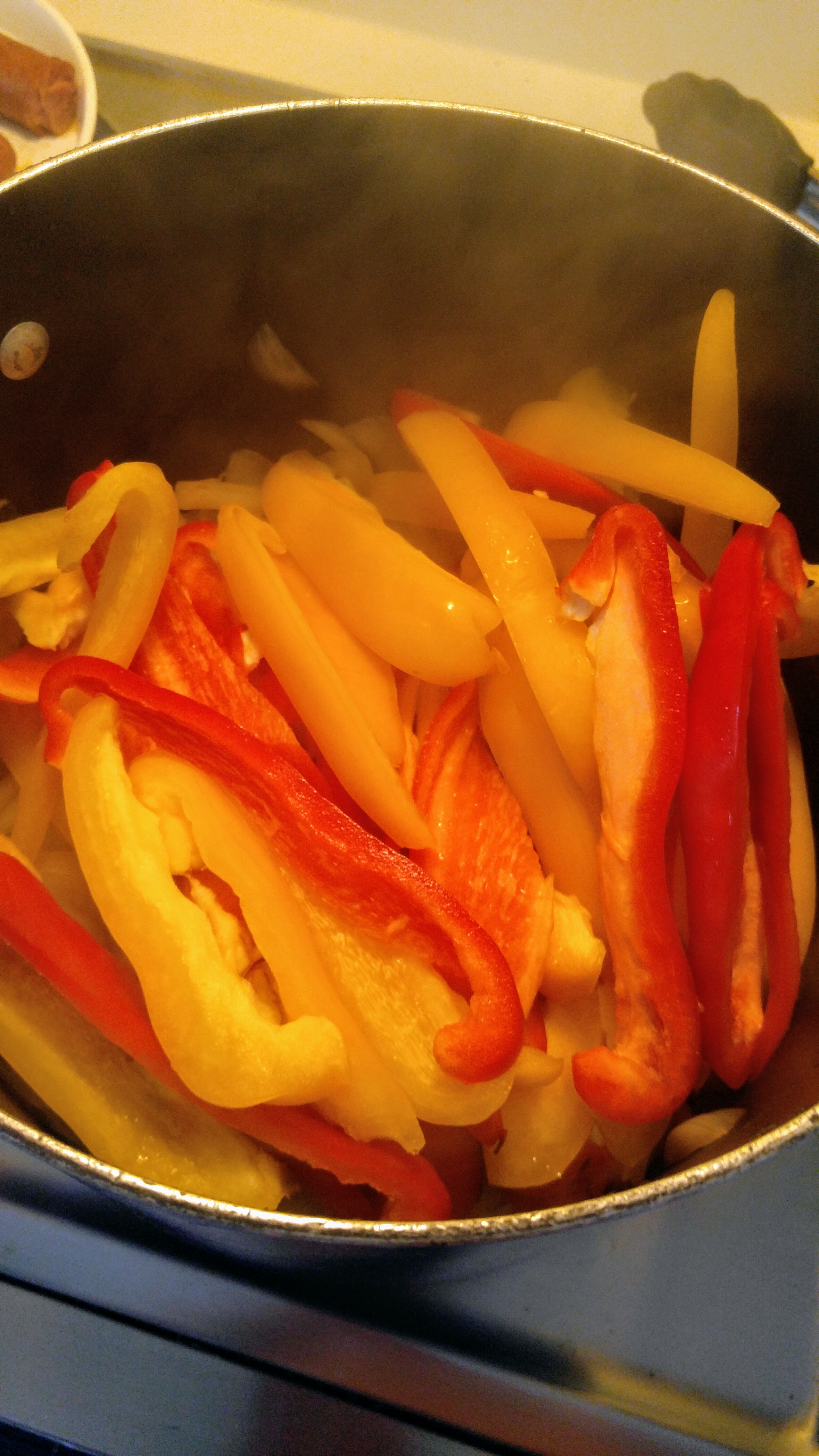 sliced peppers in pot.jpg