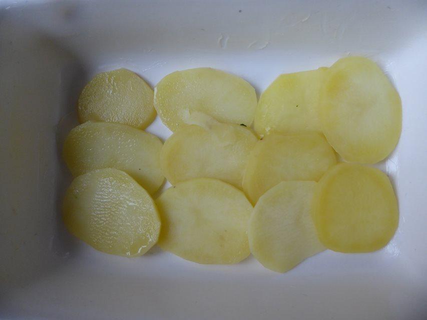 sliced potato in dish.JPG