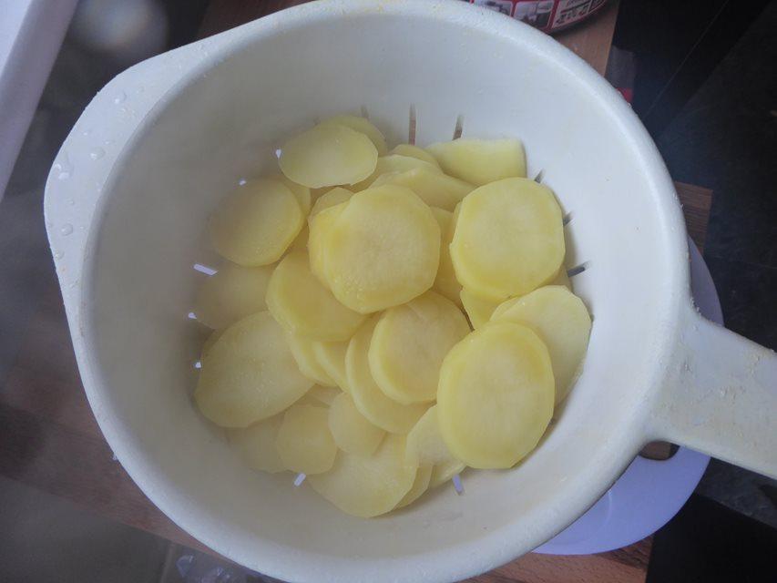 sliced potatoes drained.JPG