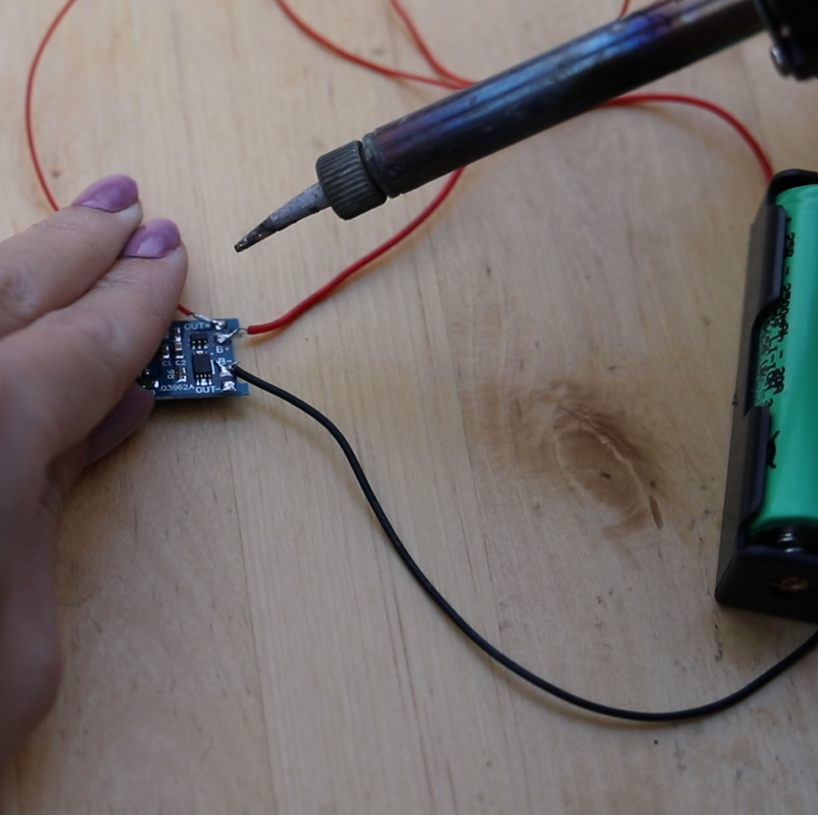 step_3_solder_push_button_to_positive_charge_controller.png