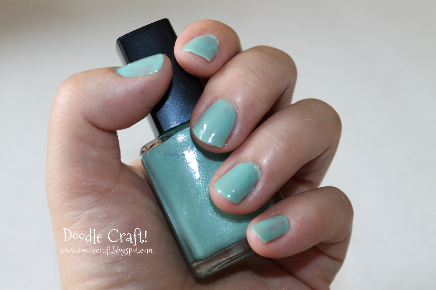 teal nail polish kicked up with eyeshadow to match color perfection.jpg